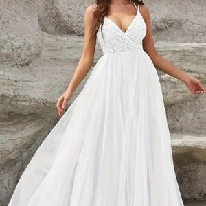 White Spaghetti Strap V-Neck Flowing Maxi Dress